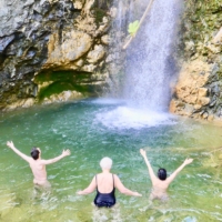 Image of 3 bathers in the waterfall at Molino Del Rey, Spain. Click to purchase the International Education in Vocal Wellness Course November 2025